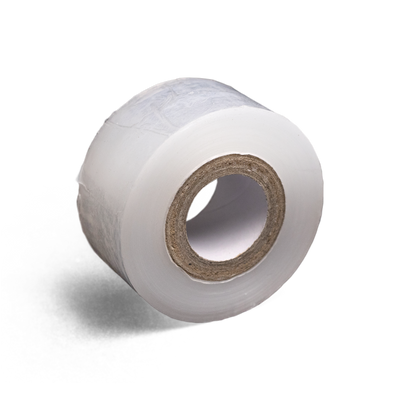 A roll of Microppose laboratory polyfilm, designed for mycological applications, shown on a reflective surface with a shadowed background.